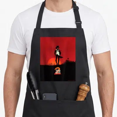 Tablier de cuisine noir avec illustration 2 Mr. Wolf The Bad Guys sur fond rouge et soleil couchant.