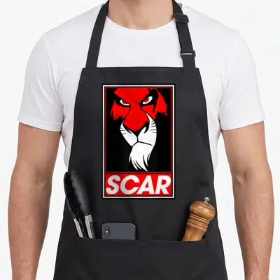 Tablier de cuisine noir avec portrait stylisé d'un lion rouge et blanc encadré et le mot SCAR en bas.
