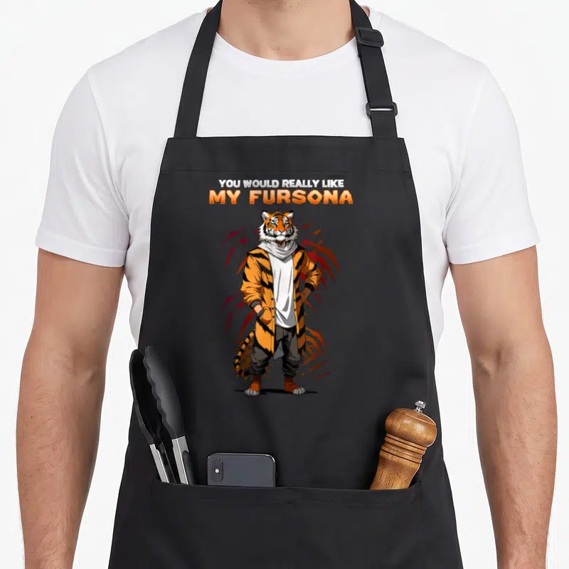 Tablier de cuisine noir avec un tige anthropomorphe en veste orange et le texte My Fursona imprimé au centre.