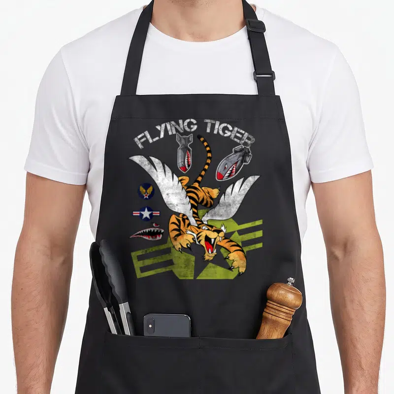 Tablier de cuisine noir avec illustration d'un tigre ailé Flying Tiger et bombes à figure de requin.