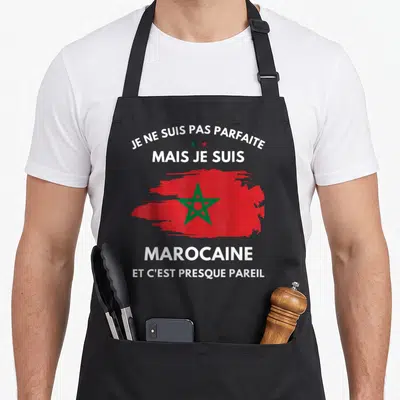 Tablier de cuisine noir avec drapeau marocain rouge et étoile verte, texte blanc Je ne suis pas parfaite mais je suis Marocaine.