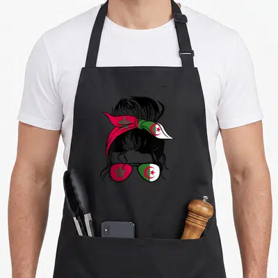 Tablier de cuisine noir avec illustration d'une femme au bandana et lunettes aux couleurs du Maroc et de l'Algérie.