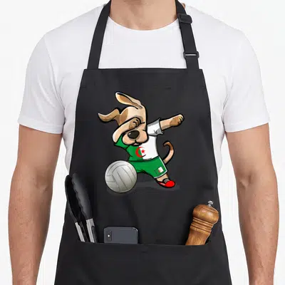 Tablier de cuisine noir avec illustration d'un chien tamponnant un ballon de volley en maillot algérien.
