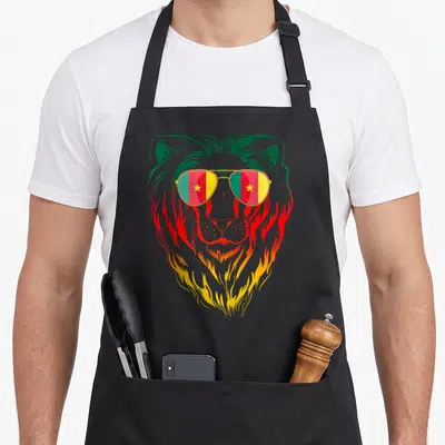 Tablier de cuisine noir avec tête de lion aux verres drapeau camerounais vert rouge et jaune
