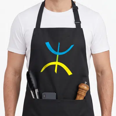 Tablier de cuisine noir avec le symbole stylisé Yaz Kabyle bleu et jaune sur fond uni.