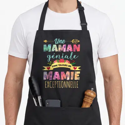 Tablier de cuisine noir avec inscription colorée Une maman géniale donne toujours une mamie exceptionnelle ornée de fleurs et d'une flèche dorée.