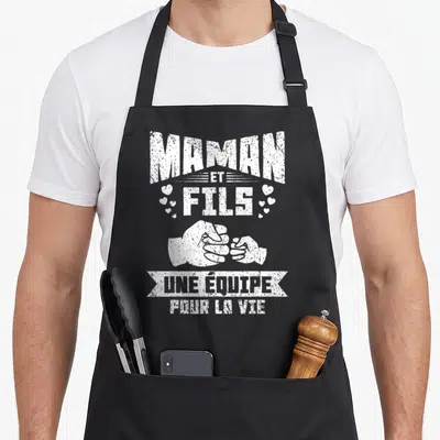 Tablier de cuisine noir avec inscription Maman et Fils une équipe pour la vie et illustration de poings serrés.