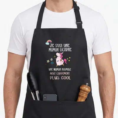 Tablier de cuisine noir avec une licorne rose, des fleurs et le texte Je susi une maman licorne plus cool.
