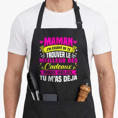 Tablier de cuisine noir avec inscription humoristique rose et jaune dédiée à maman pour un anniversaire original.