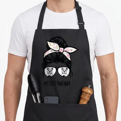 Tablier de cuisine noir avec illustration de femme au chignon floral et lunettes à reflets de chienStaffordshire Bull Terrier
