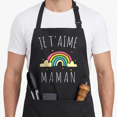 Tablier de cuisine noir avec arc-en-ciel coloré, nuages jaunes et texte blanc Je t'aime Maman.