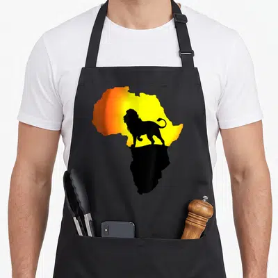 Tablier de cuisine noir avec silhouette de lion sur carte dAfrique orange et jaune soleil