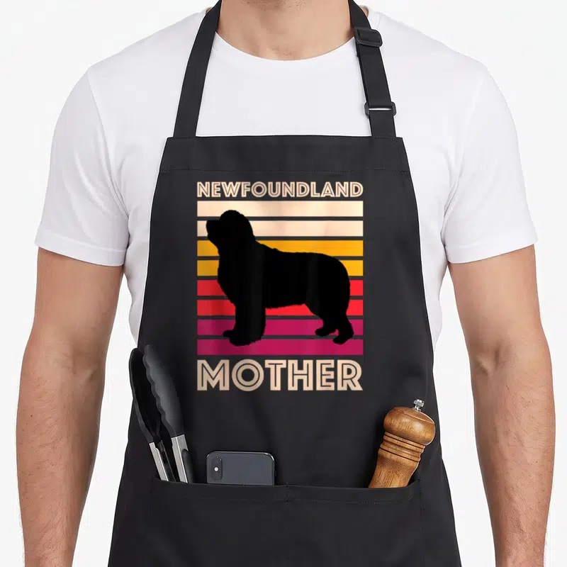 Tablier de cuisine noir avec silhouette de chien Newfoundland et texte Newfoundland Mother sur fond rayé coloré.