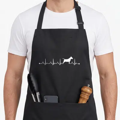 Tablier de cuisine noir avec tracé EKG blanc intégrant la silhouette d'un Bull Terrier en position debout.