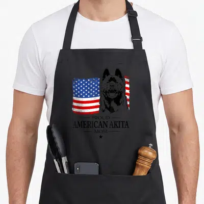 Tablier de cuisine noir avec illustration d'Akita et drapeau américain aux couleurs vives.