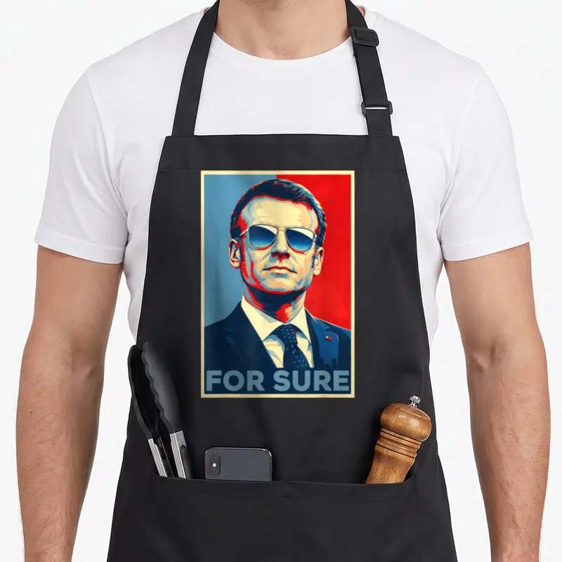 Tablier de cuisine noir avec portrait parodique aux lunettes aviator et texte For Sure en bas.