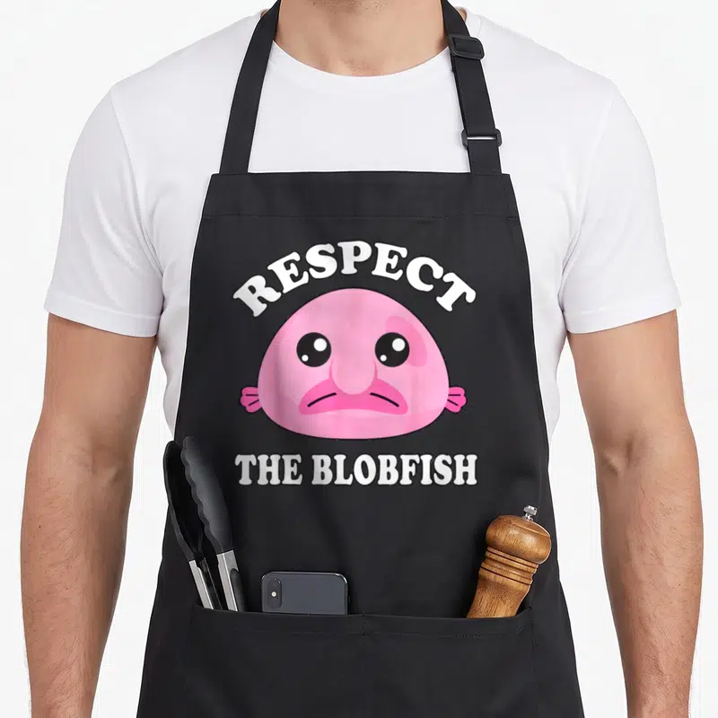 Tablier de cuisine noir avec illustration rose du Blobfish et texte blanc Respectez The Blobfish