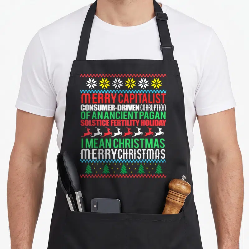 Tablier de cuisine noir avec inscription Merry Capitalist Pagan Vacances Moche Noël et motifs de Noël colorés.