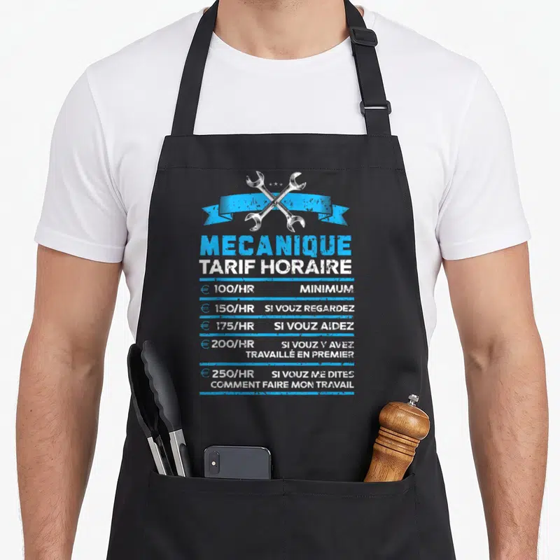 Tablier de cuisine noir avec deux clés croisées et un tarif horaire mecano imprimé en bleu et blanc.