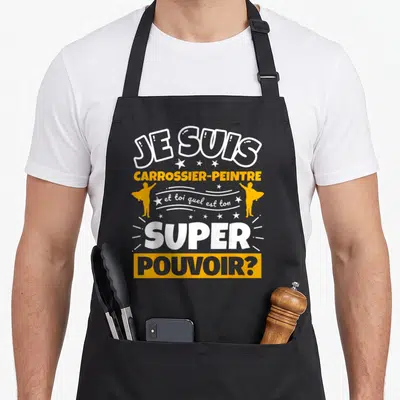 Tablier de cuisine noir avec inscription Je suis carrossier-peintre et toi quel est ton super pouvoir en blanc et orange.