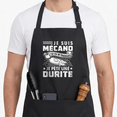 Tablier de cuisine noir avec inscription blanche Je suis mécano et illustration de durite.