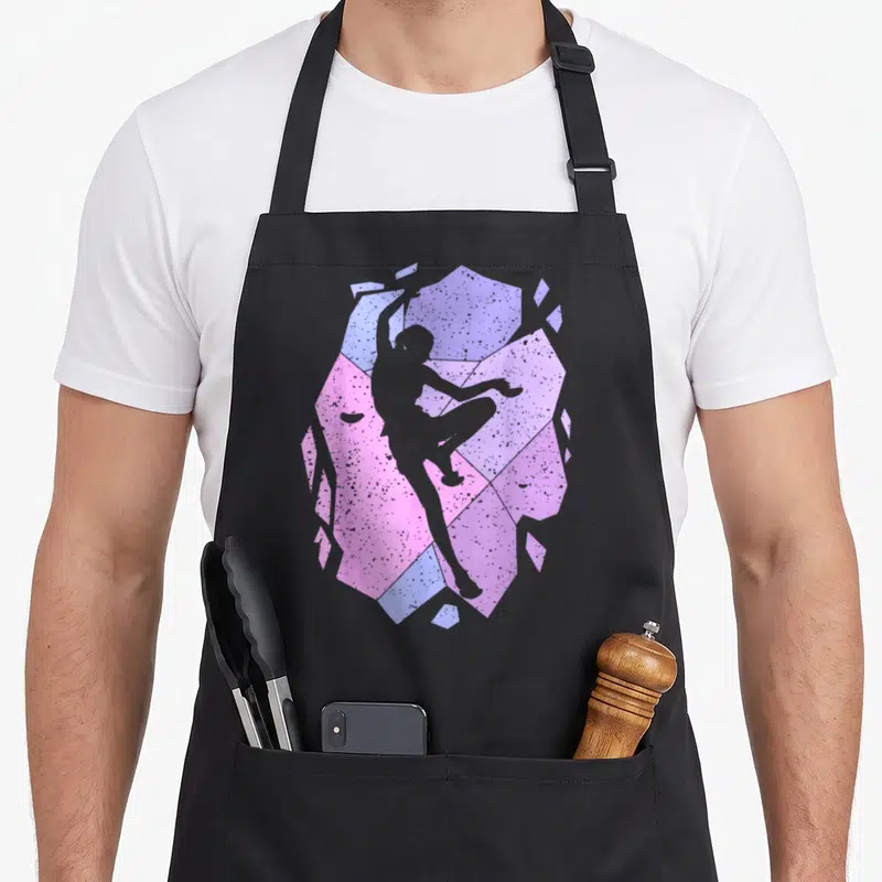 Tablier de cuisine noir avec silhouette de grimpeuse sur fond géométrique rose et bleu pastel texturé.
