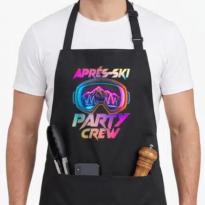 Tablier de cuisine noir avec illustration colorée d'une lunette de ski reflétant des montagnes et forêts sous un style néon rétro.