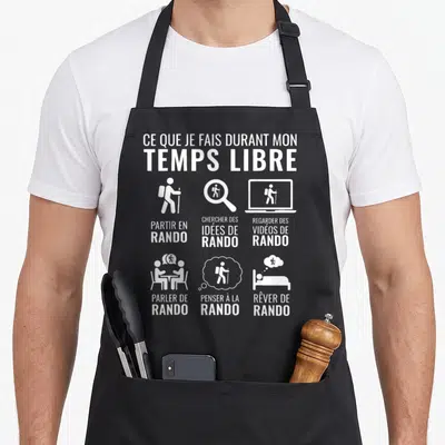 Tablier de cuisine noir avec inscription blanche Ce que je fais durant mon temps libre et six pictogrammes représentant la passion de la randonnée.