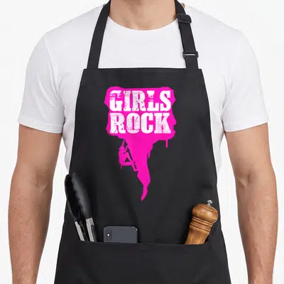 Tablier de cuisine noir avec inscription Girls Rock et silhouette d'escaladeuse rose fluo.