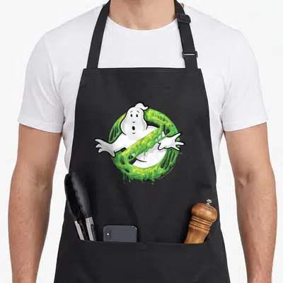 Tablier de cuisine noir avec un ghost blanc traversé par une barre de slime vert fluide.