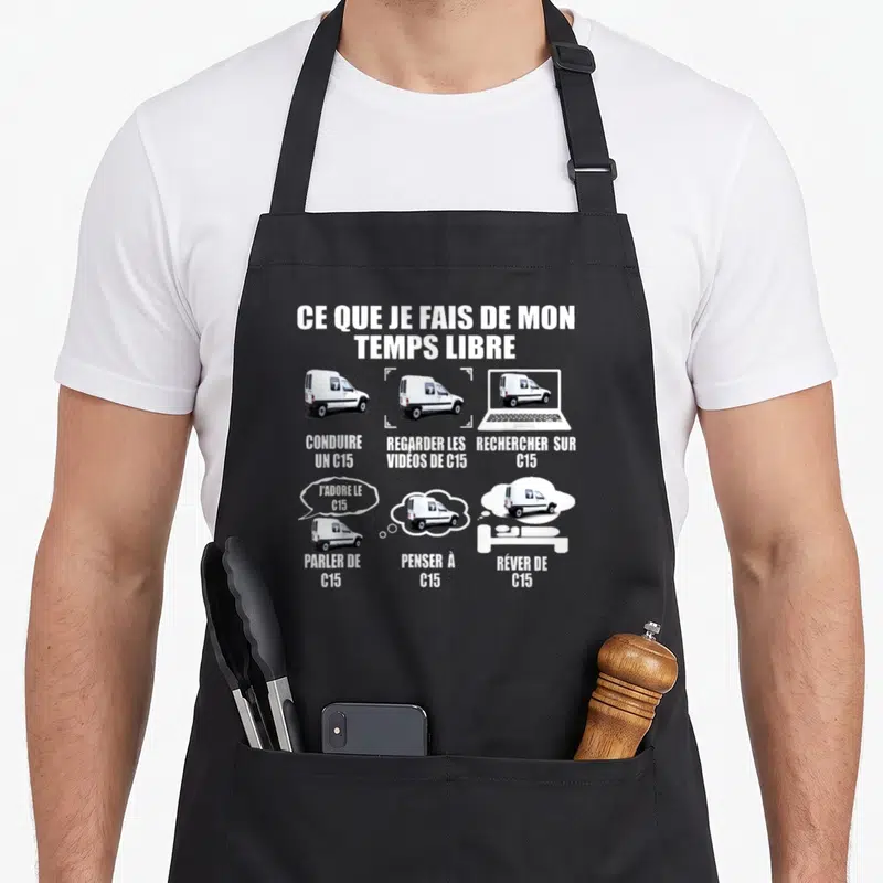 Tablier de cuisine noir avec illustration blanche d'une Citroën C15 et textes humoristiques sur le temps libre, ordinateur et dreams.