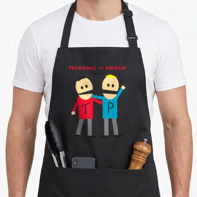 Tablier de cuisine noir avec les personnages Terrance et Phillip du spectacle et leurs initiales TP.