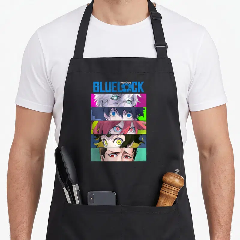 Tablier de cuisine noir avec les yeux colorés des personnages de Blue Lock et le logo du titre imprimé en haut.