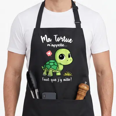 Tablier de cuisine noir avec une tortue verte et le texte Ma Tortue m'appelle Faut que j'y aille.