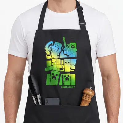 Tablier de cuisine noir avec personnages Minecraft en dégradé bleu vert et épée pixelisée.