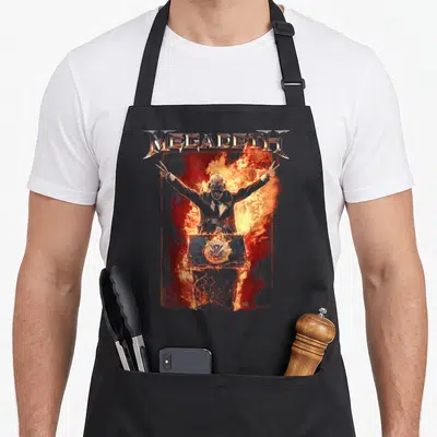 Tablier de cuisine noir avec logo Megadeth et silhouette enflammée aux bras levés.