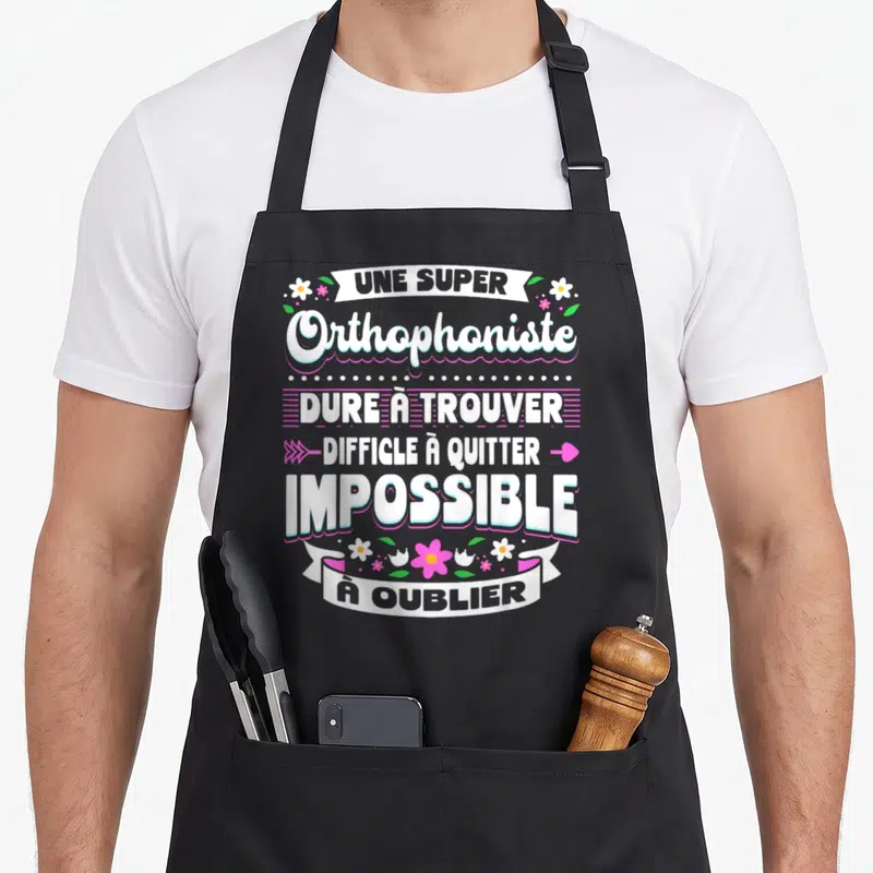Tablier de cuisine noir avec inscription Une Super Orthophoniste Dure à Trouver Difficile à Quitter Impossible à Oublier entouré de fleurs roses et blanches.