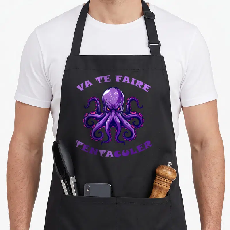 Tablier de cuisine noir avec un poulbe violet agressif et le texte va te faire tentaculer imprimé en violet clair.