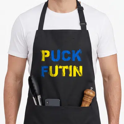Tablier de cuisine noir avec l'inscription Puck Futin aux couleurs bleu et jaune ukrainiennes.