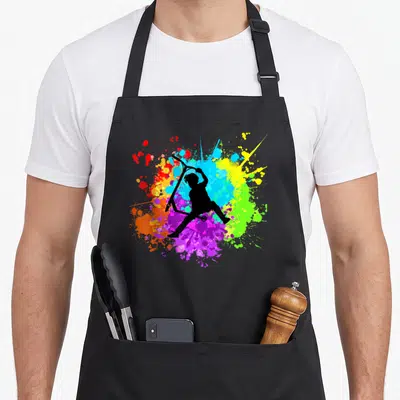 Tablier de cuisine noir avec silhouette trottinette freestyle et éclaboussures de peinture multicolores vives.