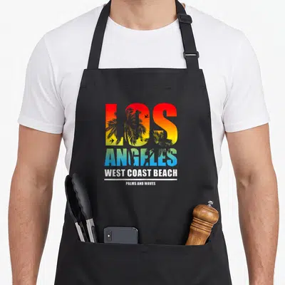 Tablier de cuisine noir avec inscription Los Angeles West Coast Beach et motifs de palmiers colorés.