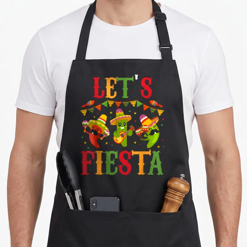 Tablier de cuisine noir avec cactus et piments en sombrero jouant de la musique sous l'inscription Let's Fiesta.