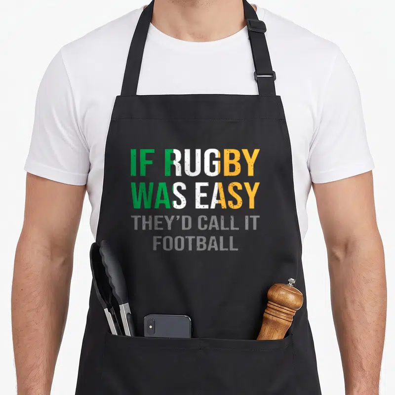 Tablier de cuisine noir avec inscription If Rugby Was Easy They D Call It Football en vert blanc et orange.