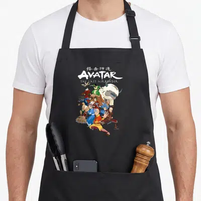 Tablier de cuisine noir avec illustration colorée des personnages d'Avatar The Last Airbender et leur logo stylisé en haut.