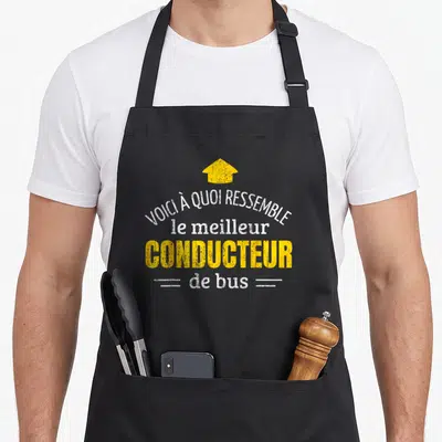 Tablier de cuisine noir avec inscription Voici à quoi ressemble le meilleur conducteur de bus et flèche jaune vers le haut.