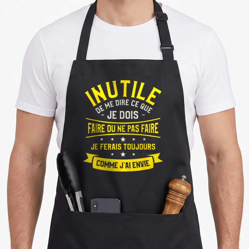 Tablier de cuisine noir avec inscription jaune et blanche Inutile de me dire ce que je dois faire ou ne pas faire Je ferais toujours comme j'ai envie.