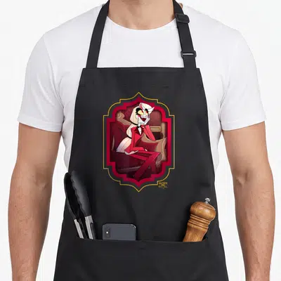 Tablier de cuisine noir avec illustration de Charlie assise dans un cadre rouge et or au styleHazbin Hôtel