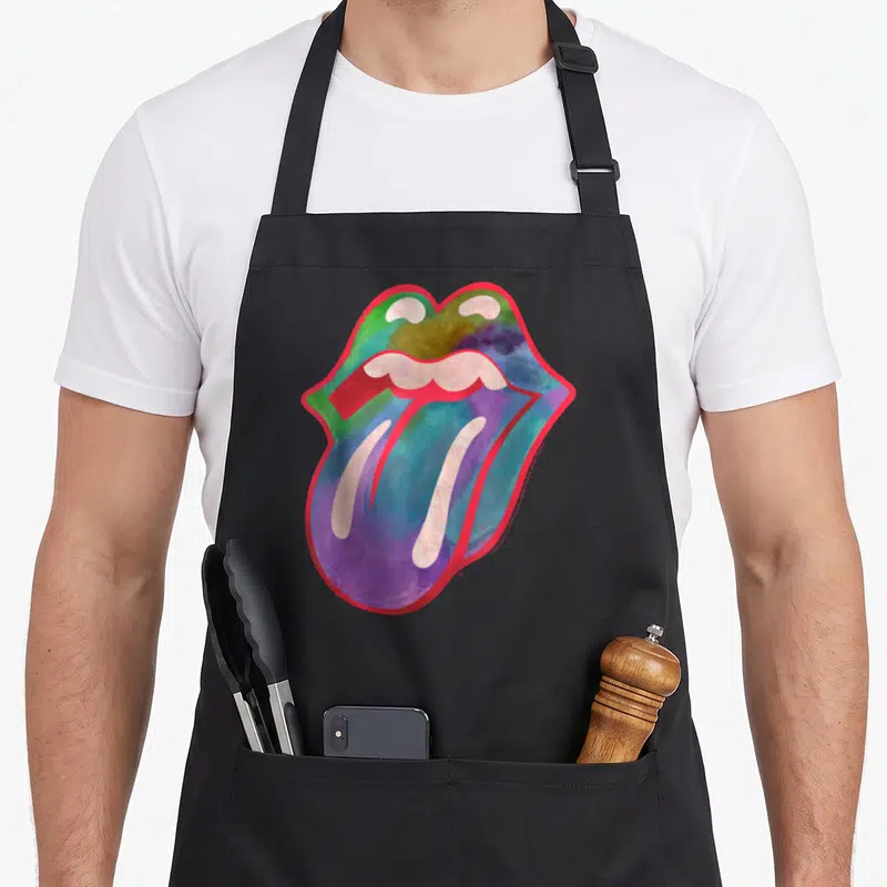 Tablier de cuisine noir avec illustration artistique de lèvres et langue aux couleurs aquarellées et contour rose vif.