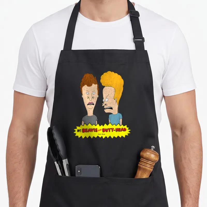 Tablier de cuisine noir avec les têtes de Beavis et Butt-Head sur fond jaune et logo MTV en bas.