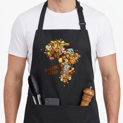 Tablier de cuisine noir avec une carte d'Afrique stylisée en couleur contenant des lions, masques et poteries traditionnelles.
